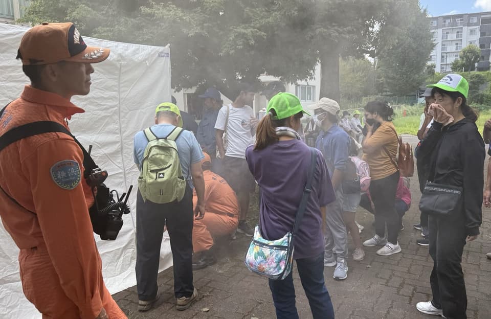 Participants tour an evacuation center