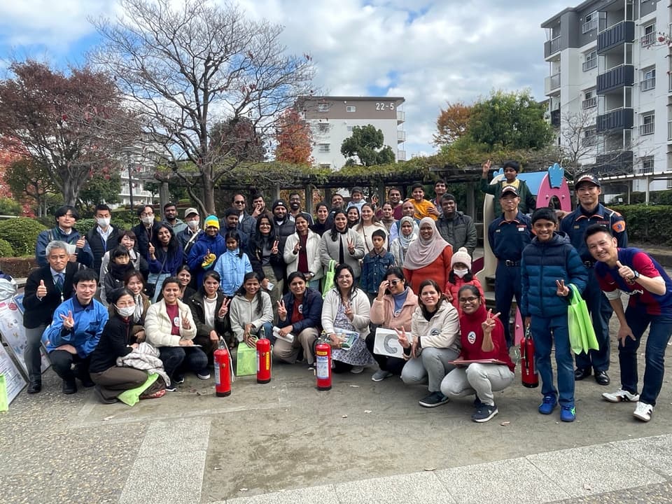 Residents and Yokohama fire department staff at the ReadyJapan × ReadyKirigaoka disaster-preparedness event at Kirigaoka Green Town